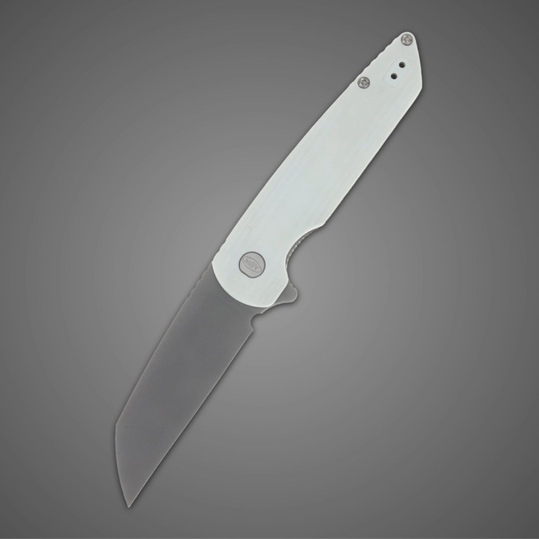 A sleek folding knife with a white handle against a gray background.