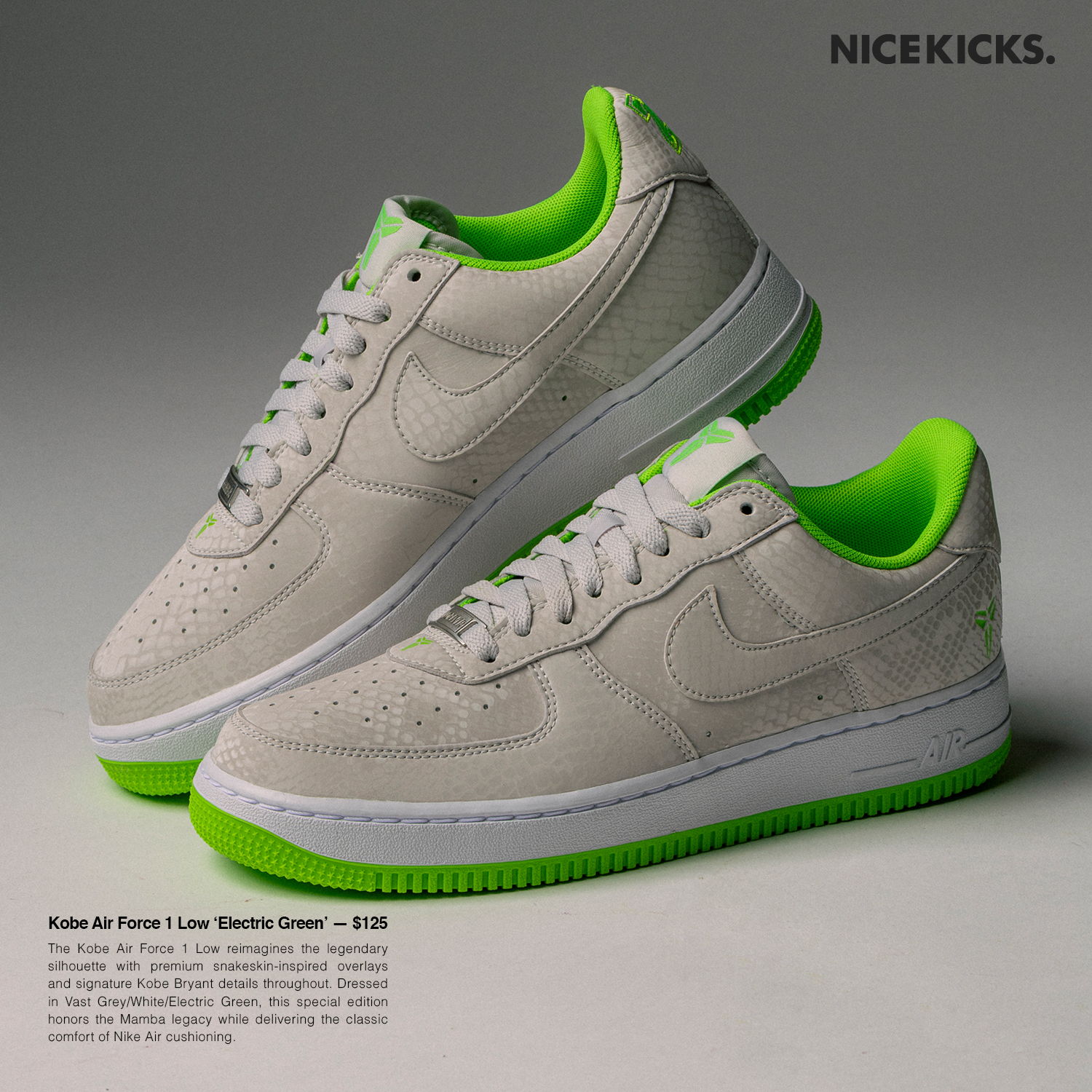Nike Air Force 1 sneakers with a white upper and green accents.