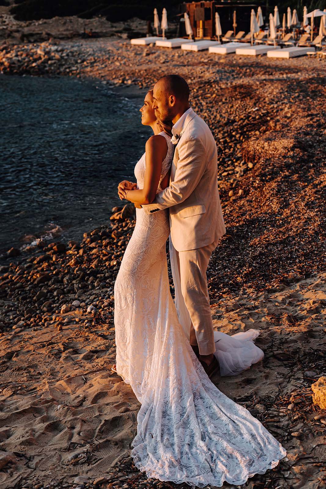 Bride and groom, contemplating the sea