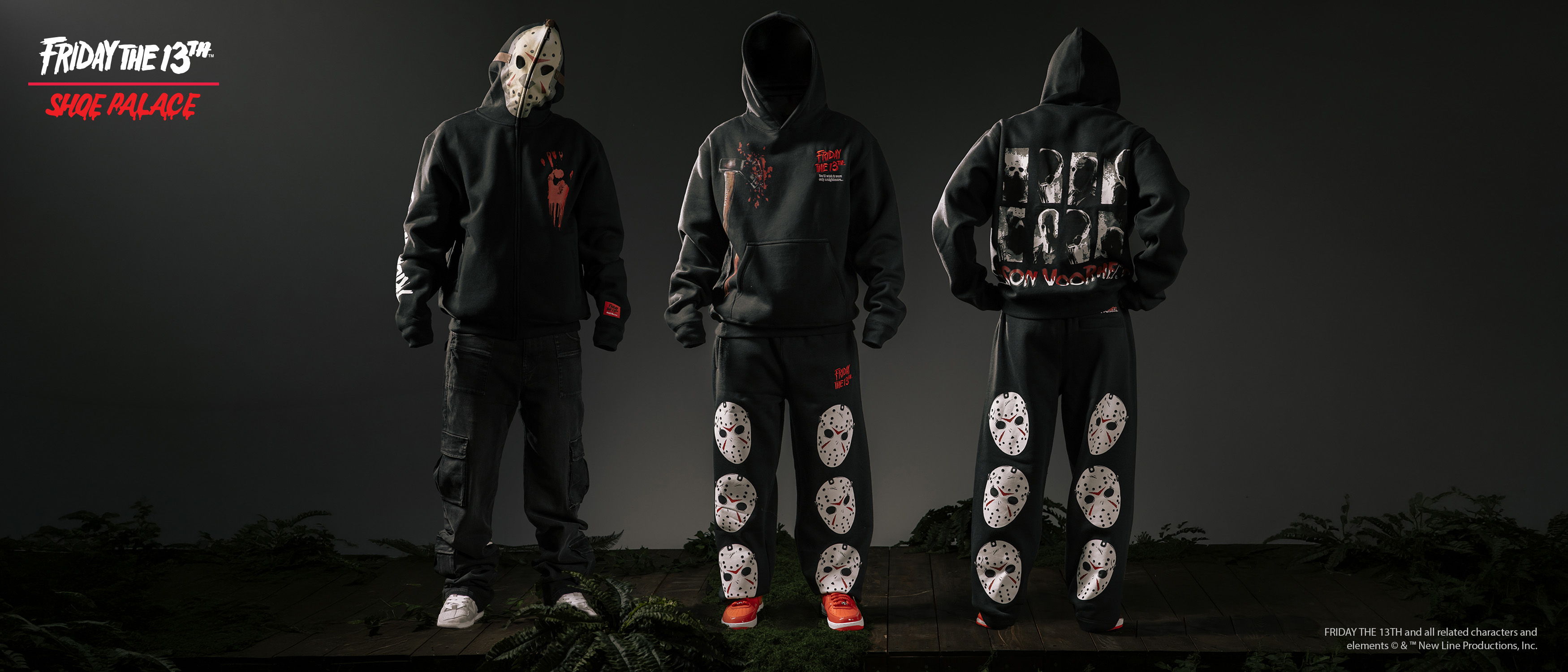Three figures in dark hooded outfits with graphic designs, standing back to back.