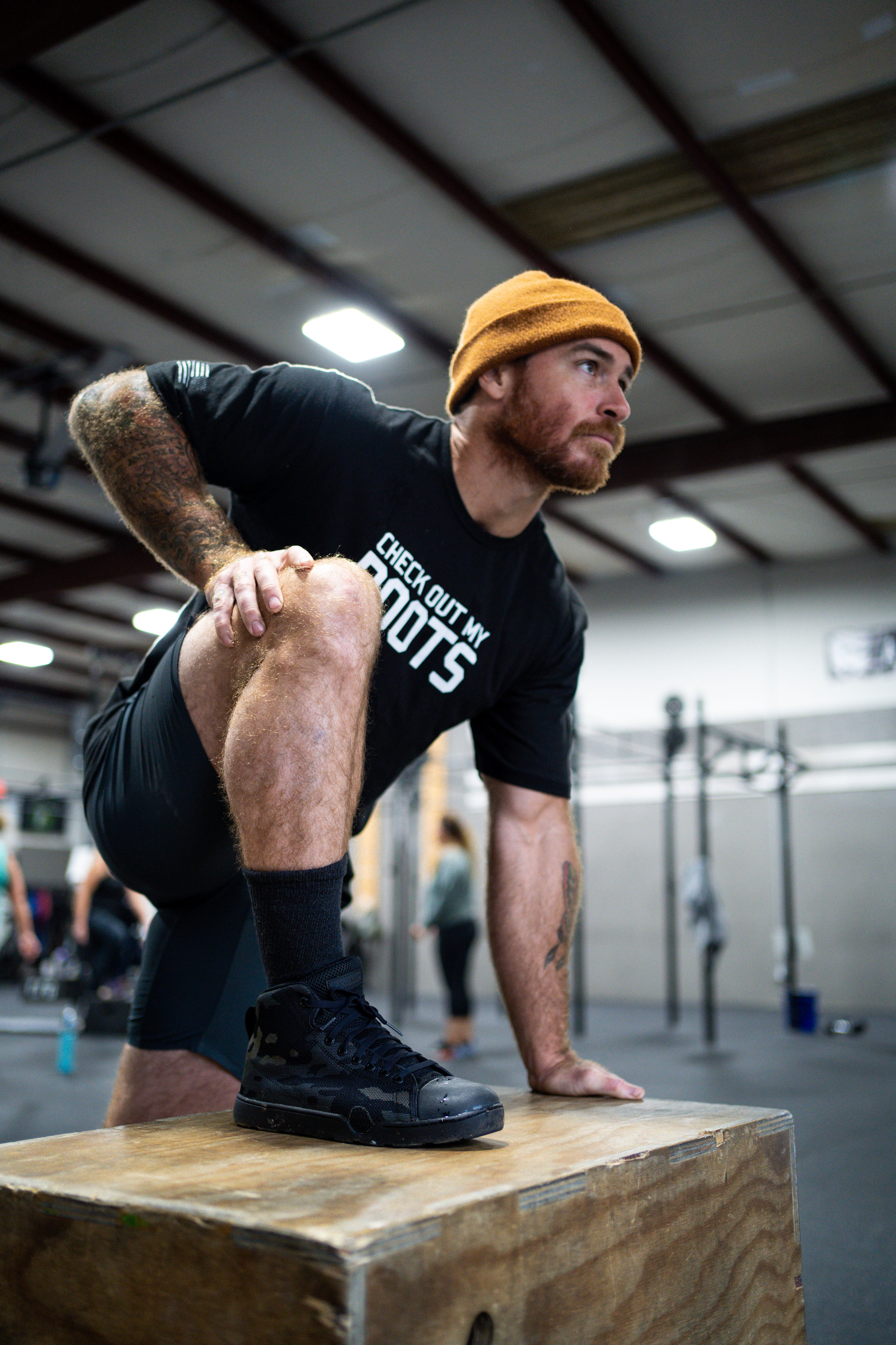 Man in gym exercising in work boots