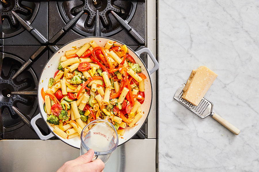 Pasta water and lemon juice added to create the sauce