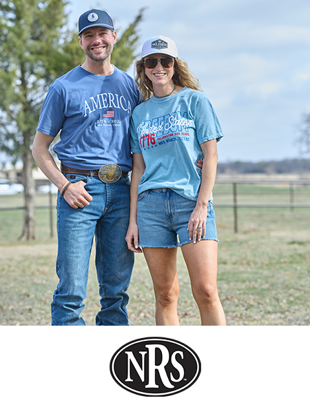 A couple wearing casual outfits stands outdoors with a logo below.