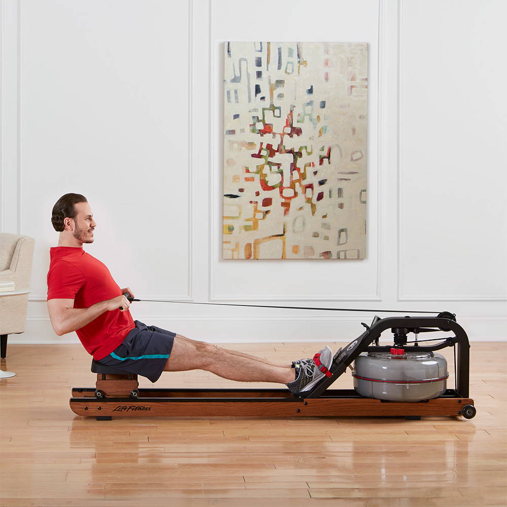 Man rowing on Row HX trainer at home