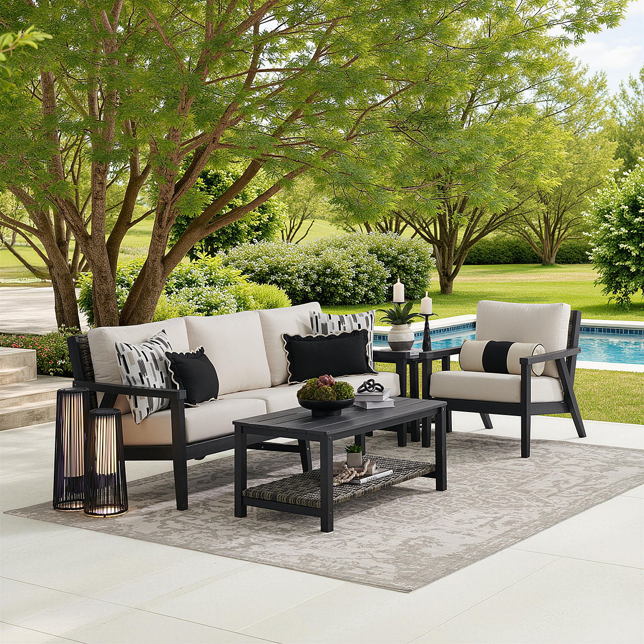 Outdoor seating area with a sofa, chairs, and a coffee table.