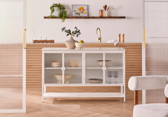 A modern kitchen with a white cabinet and wooden shelves.