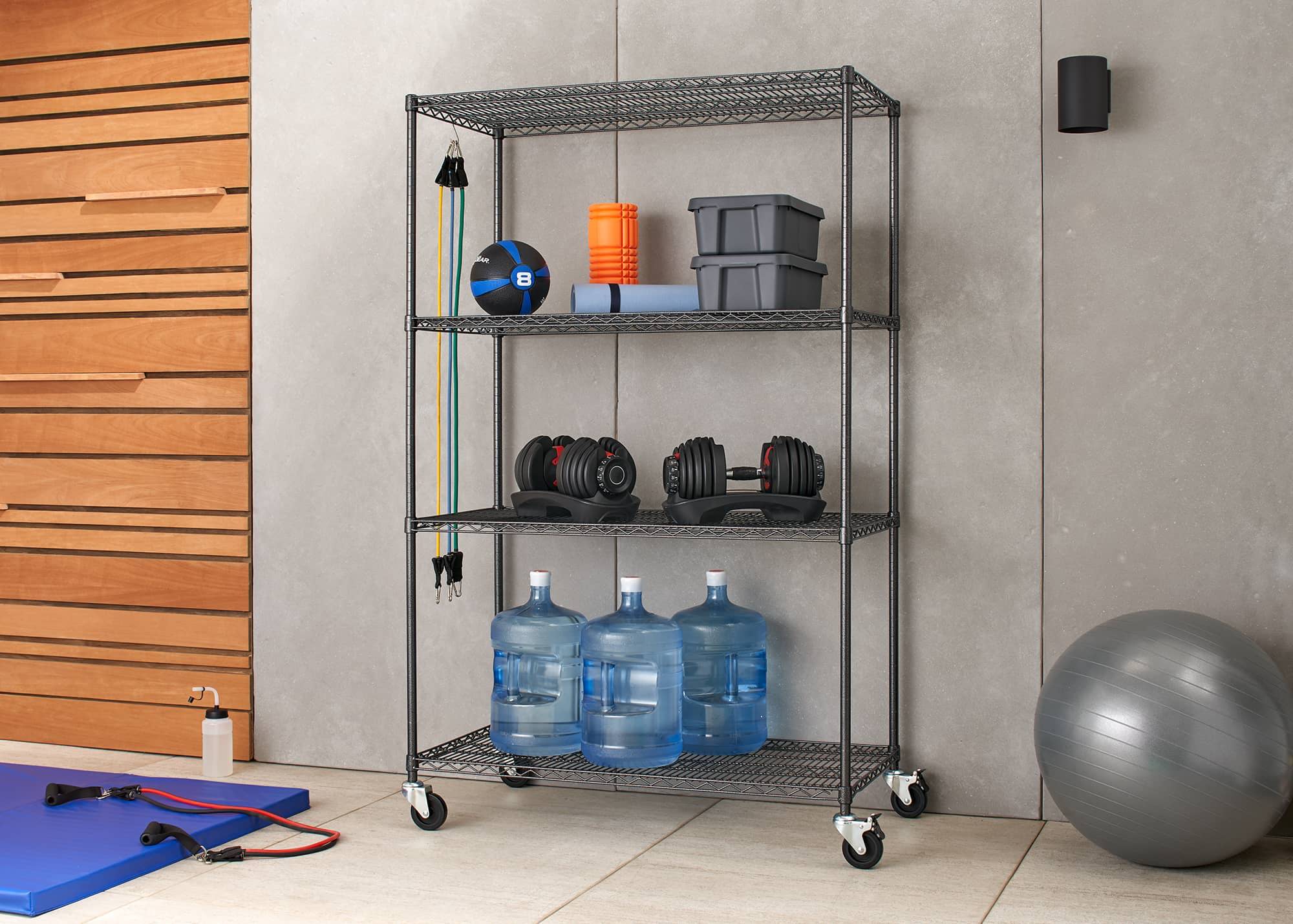 outdoor wire shelving rack with wheels filled with gym equipment