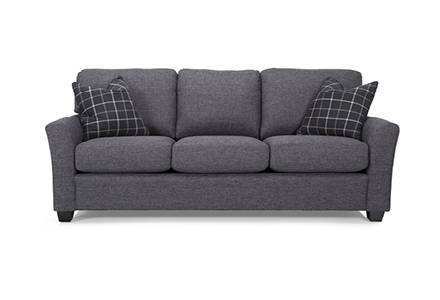 Grey sofa with black and white toss cushions.
