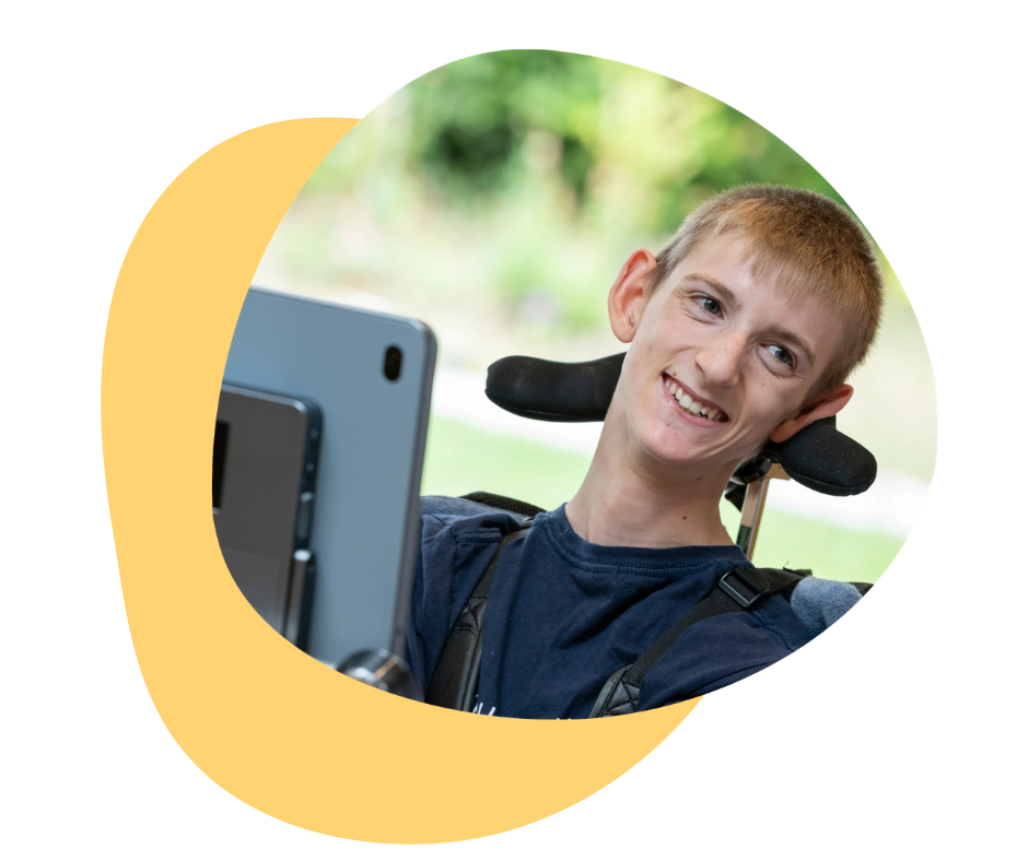 Smiling young person with Grid Pad.