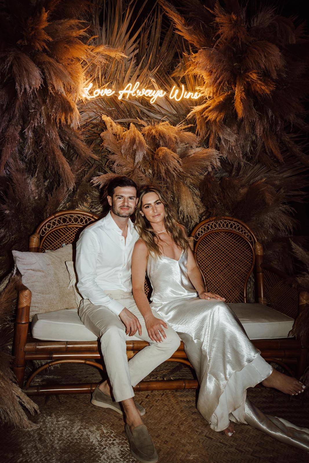 The bride and groom sitting together