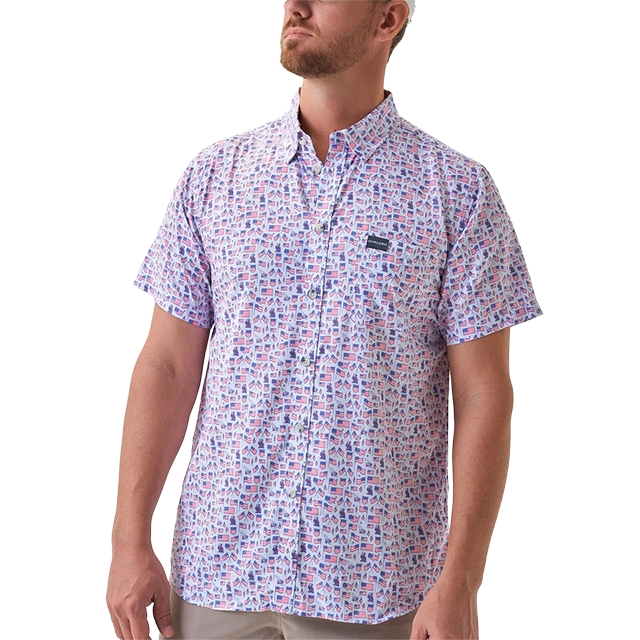 Man wearing a patterned short-sleeve shirt, looking up.