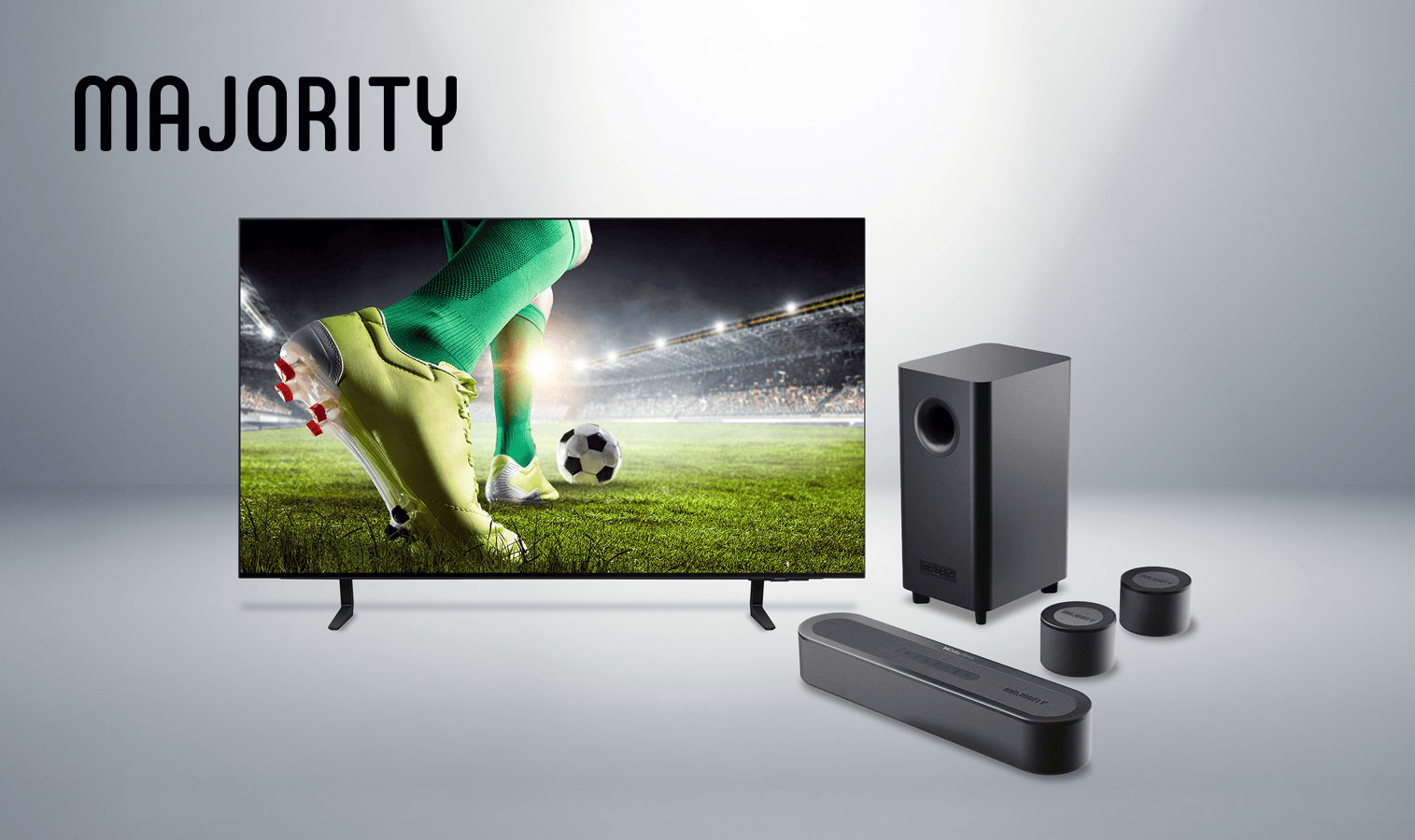 Television and sound system with soccer scene displayed. Brand: Majority.
