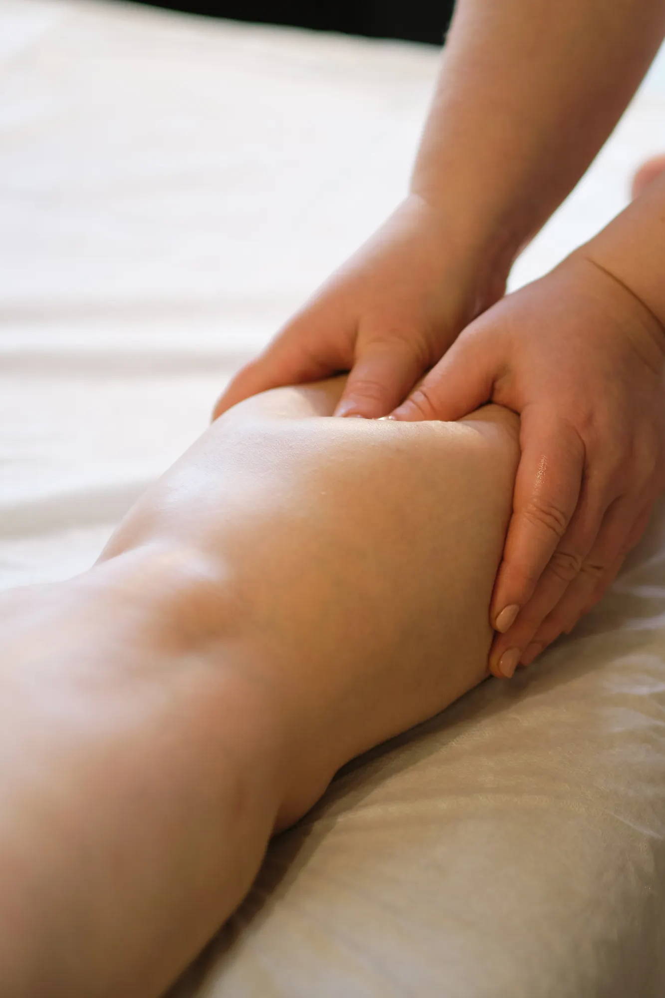 Practitioner helping relieve swelling for lymphedema patient
