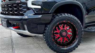 TIS544MBR Red Wheels close up on a black chevy