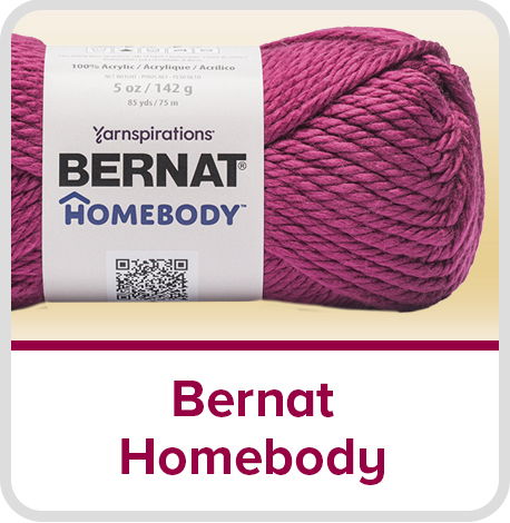 Skein of Bernat Homebody yarn in a vibrant pink color.