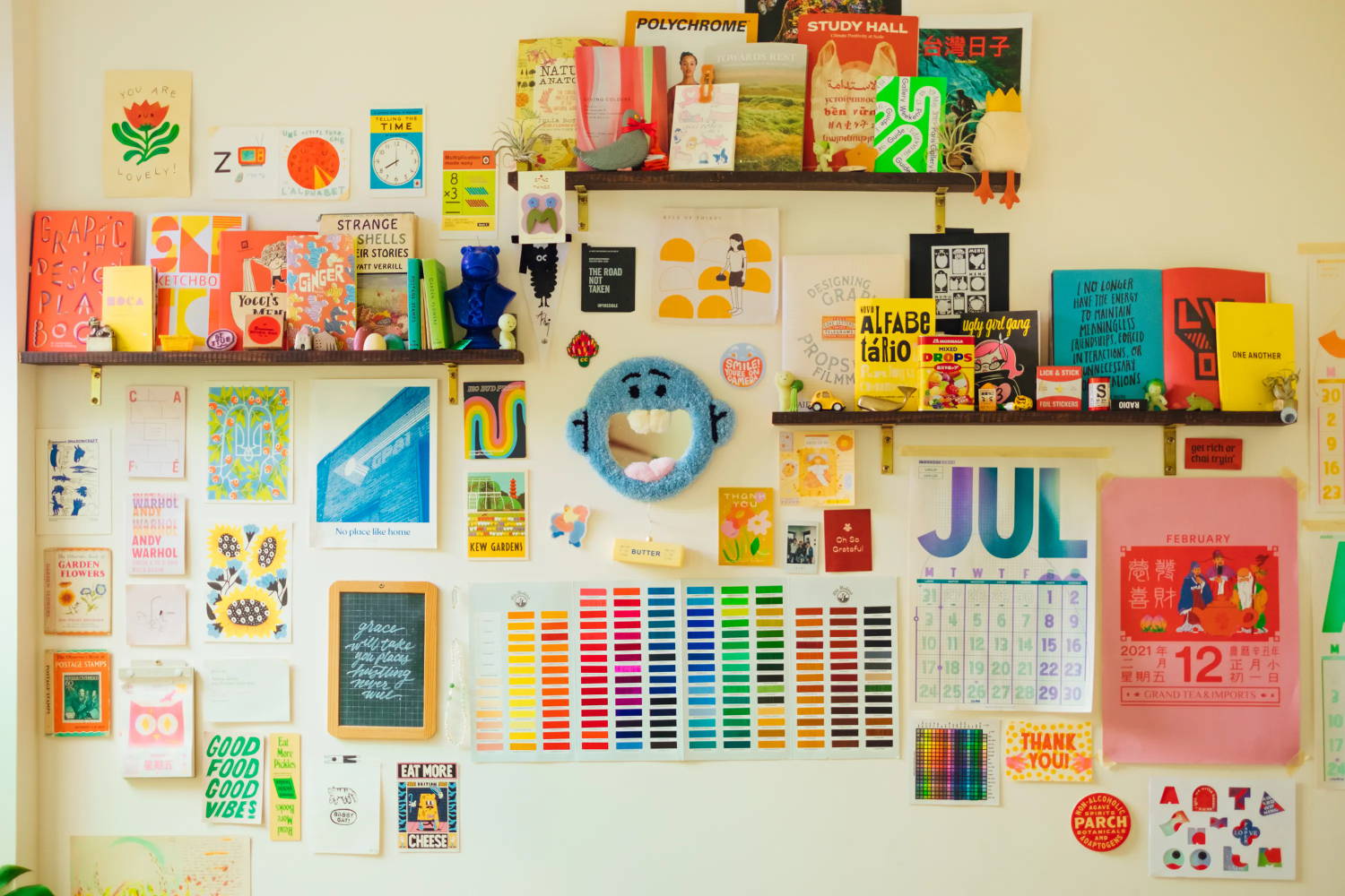 Colorfully decorated wall, featuring a calendar and color-coded tabs