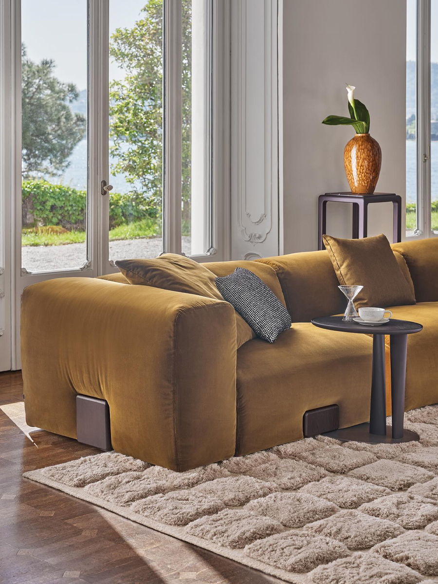 Aerial view of a cozy living room with a sectional sofa and coffee table.