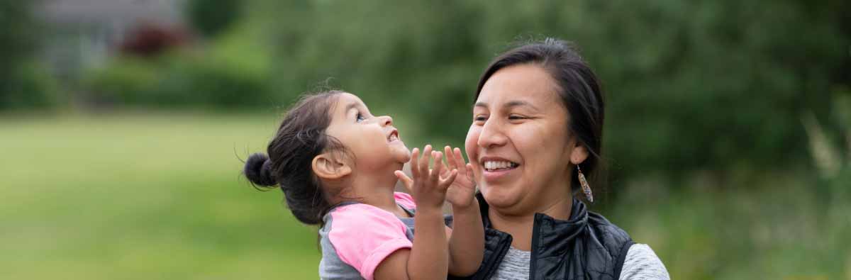 A mother and child playing outside