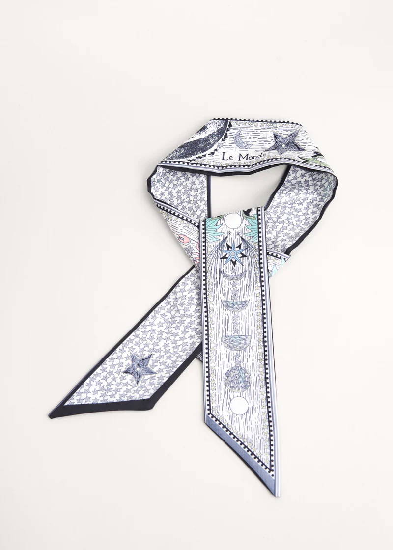 A blue, white and pale green satin neck scarf with a celestial pattern