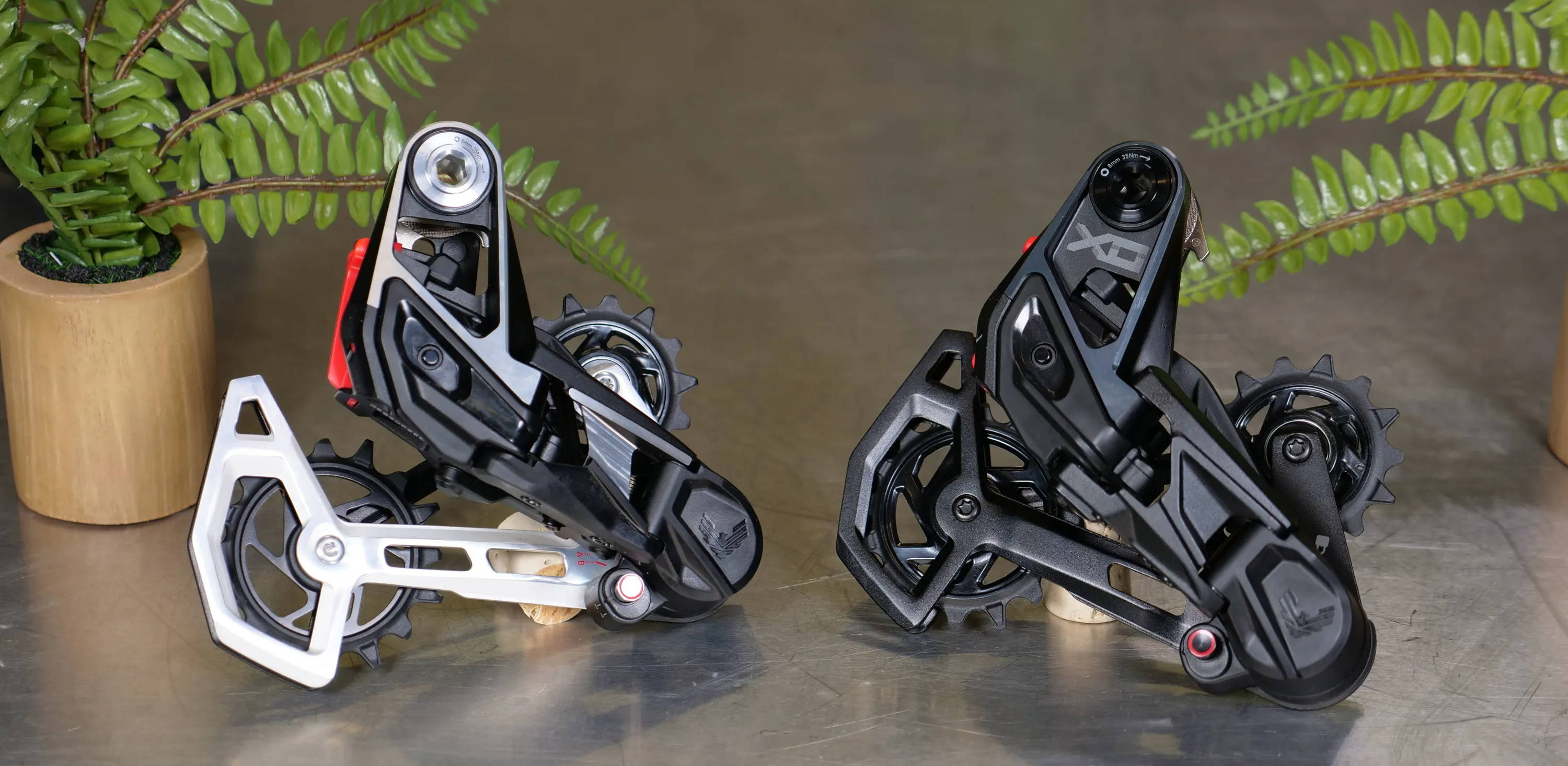 sram x0 and xx eagle t-type transmission mountain bike derailleurs on a table