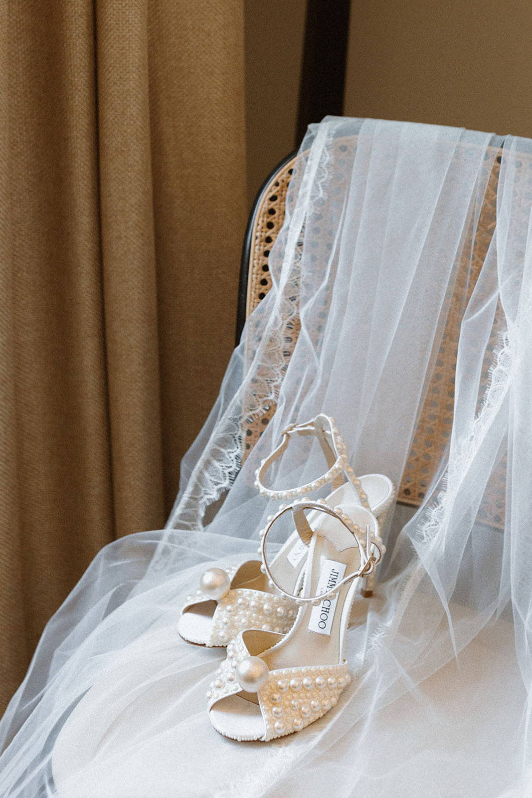 wedding dress and wedding shoes on a chair