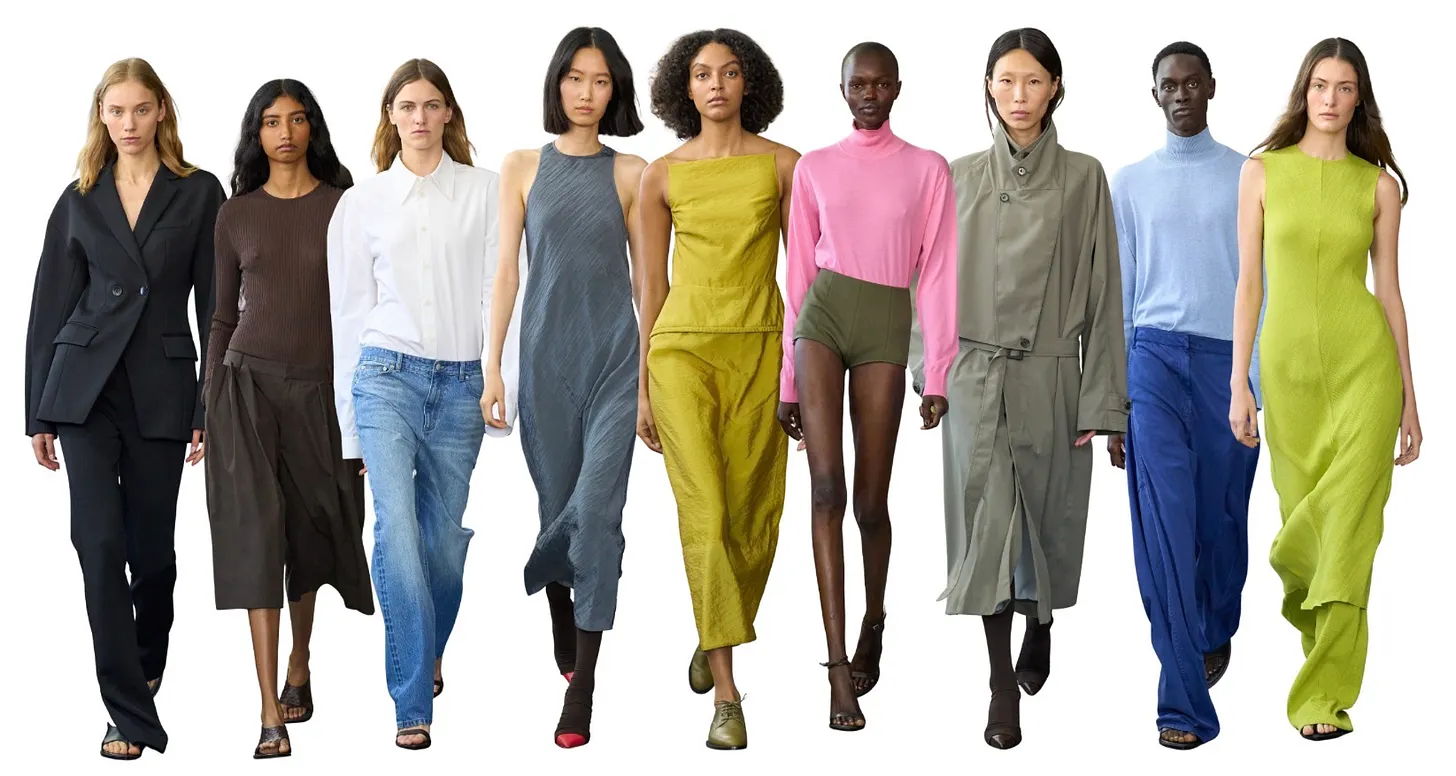 A diverse group of models showcasing various stylish outfits on a runway.
