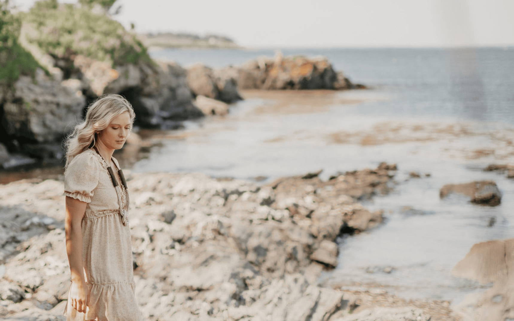 woman on the beach wearing a rope necklace