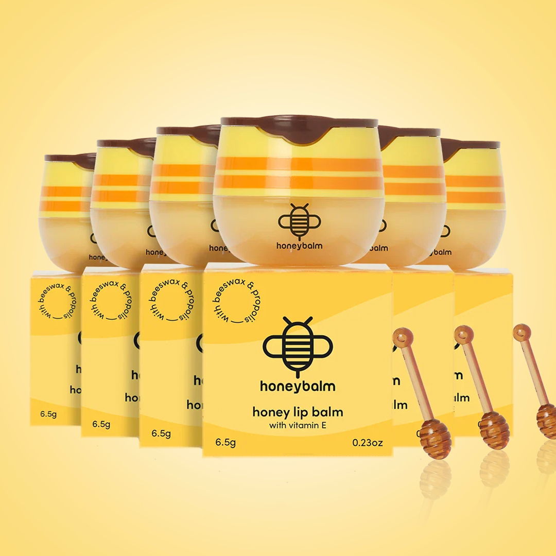 Collection of honey lip balms in yellow packaging.