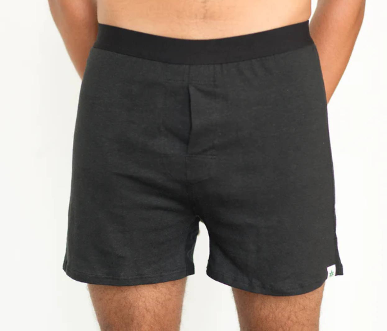 A man stands wearing WAMA hemp briefs.