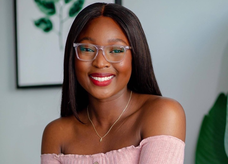 woman smiling while wearing Grace Clear migraine glasses