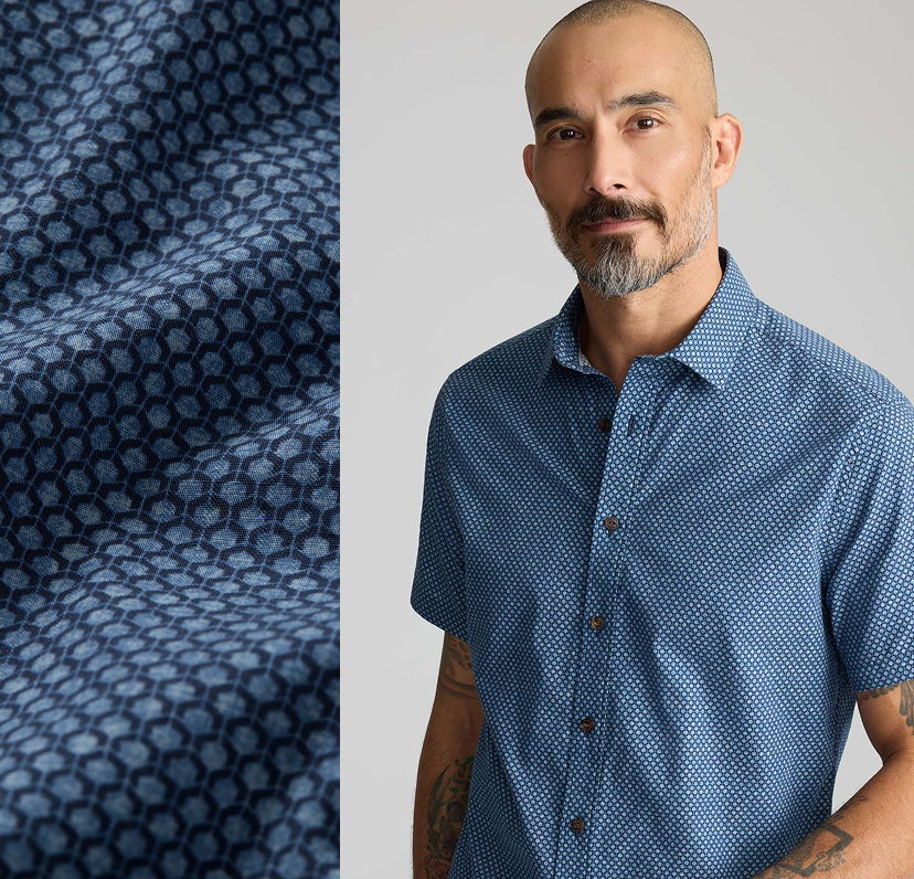Man wearing a blue patterned shirt next to fabric swatch.
