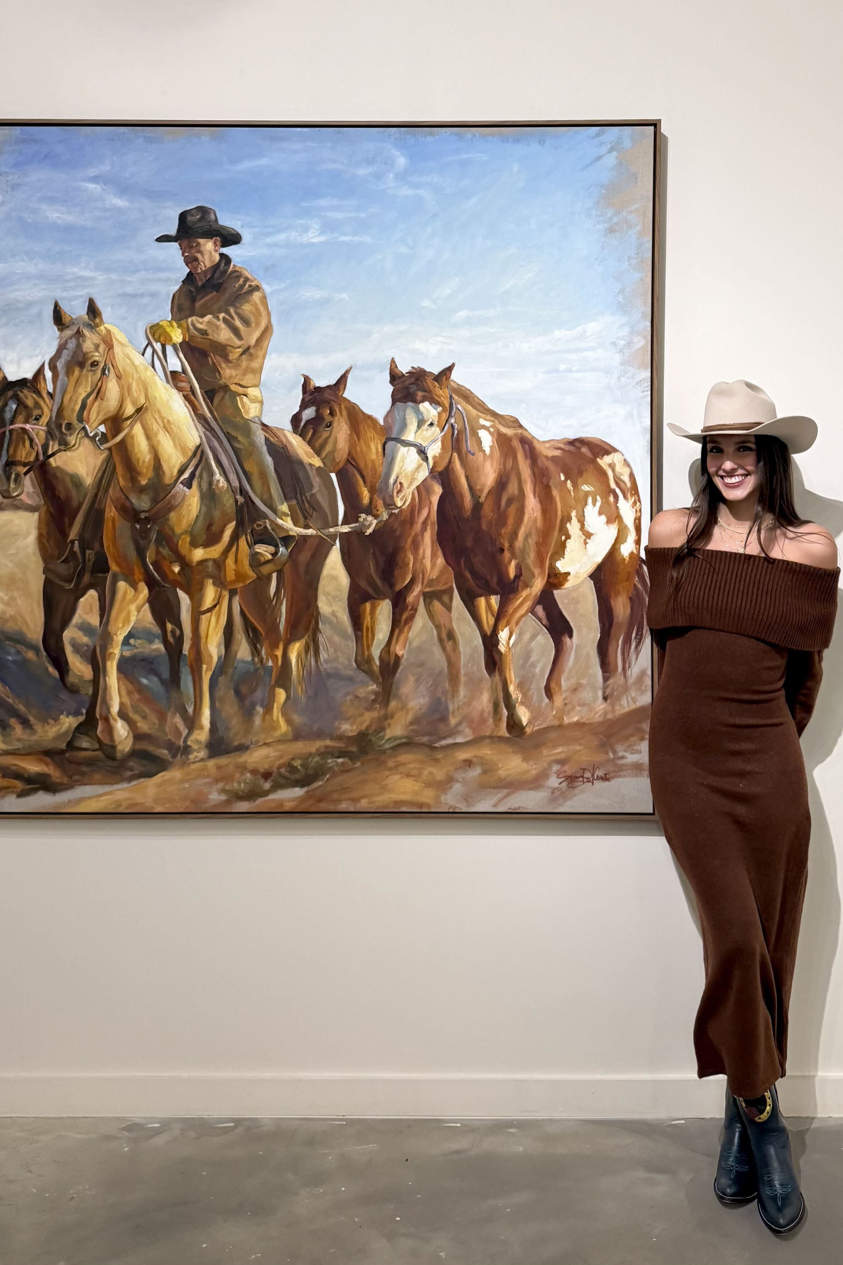 Sienna Del Conte with her artwork.