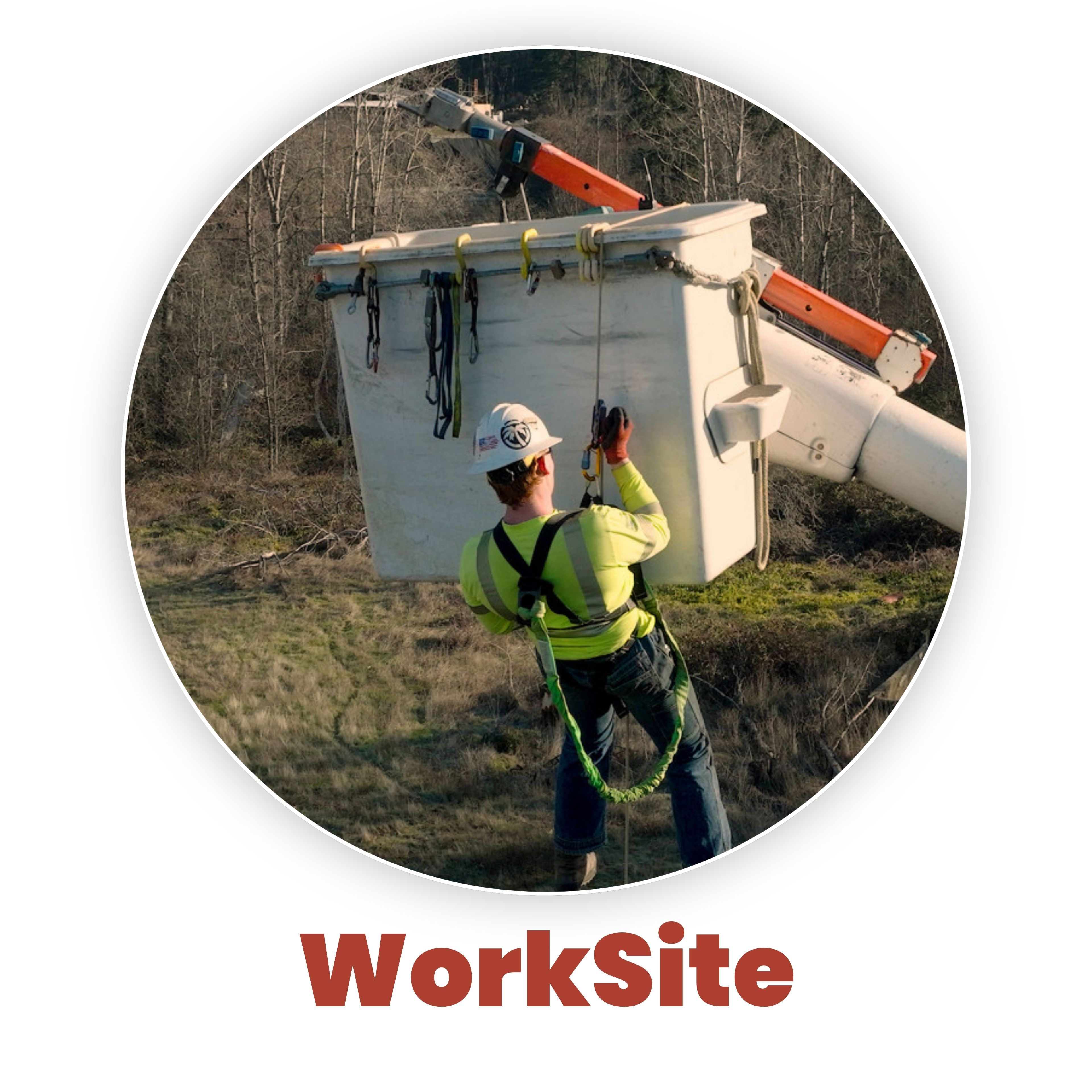 Worker in safety gear operating equipment at a construction site.