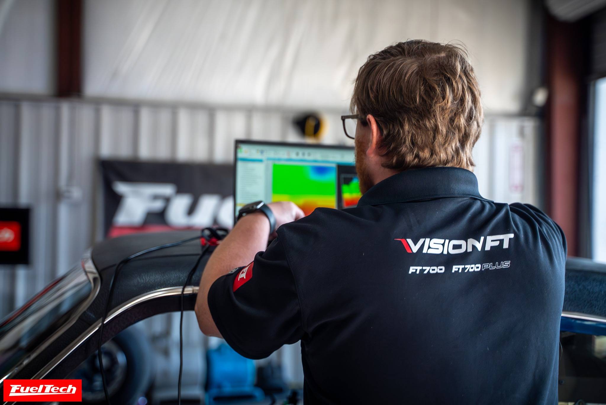 FuelTech technician tuning the aftermarket racing ECU during a dyno.