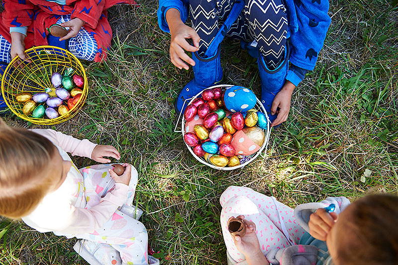 Kids with easter eggs in baskets