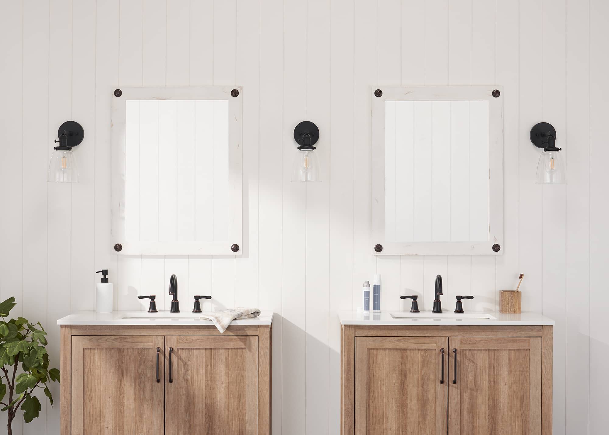 two white frame vanity mirror in a bathroom
