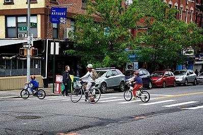 Bicycles using crosswalk in neighborhood