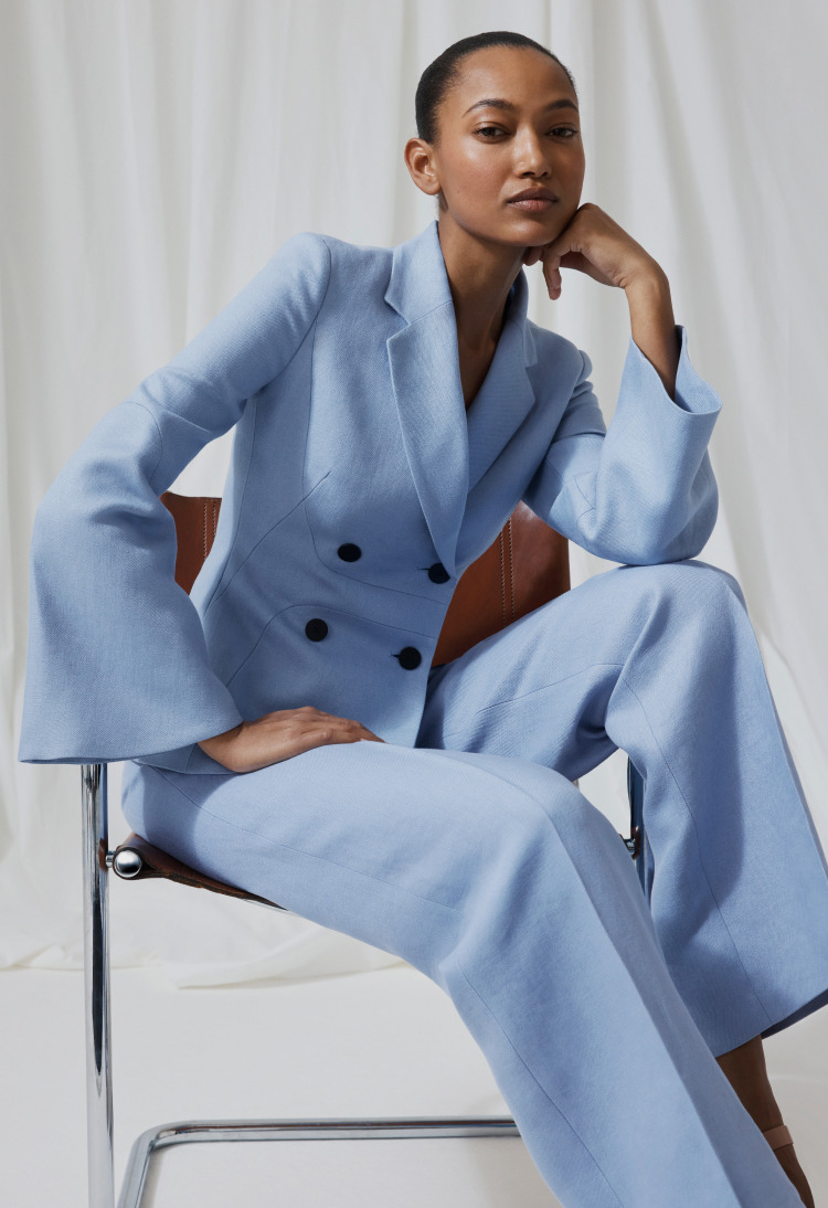 Model wearing ice blue linen suit