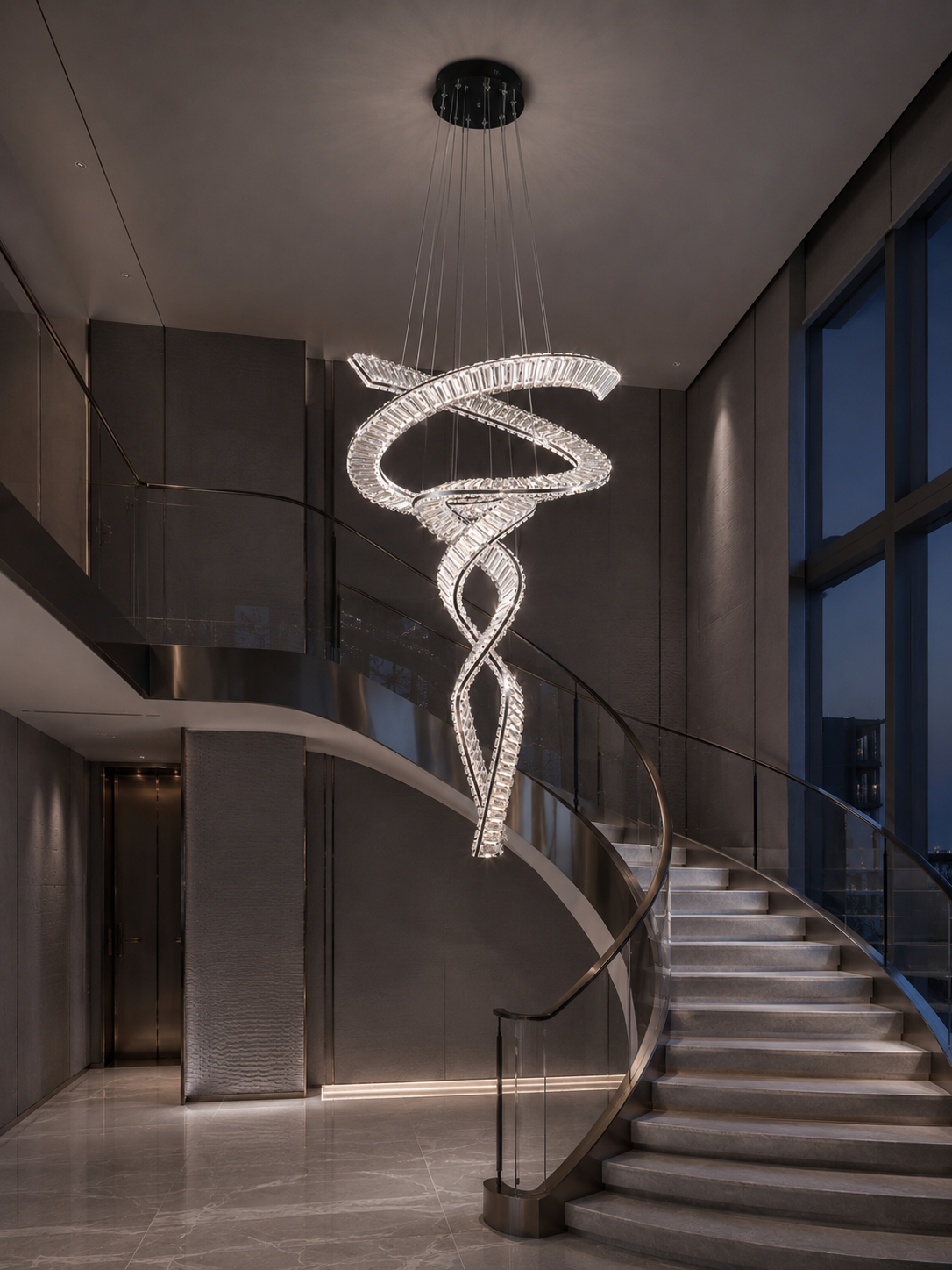 Twin spiral crystal chandelier beside a curved staircase in a double- height void, with warm light on the treads