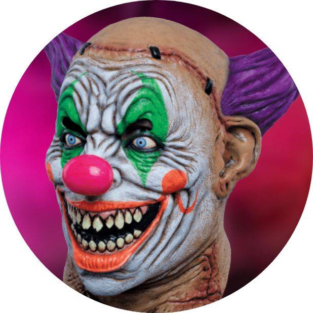 Scary white, green, pink and purple clown mask on pink background. Shop all Halloween masks.