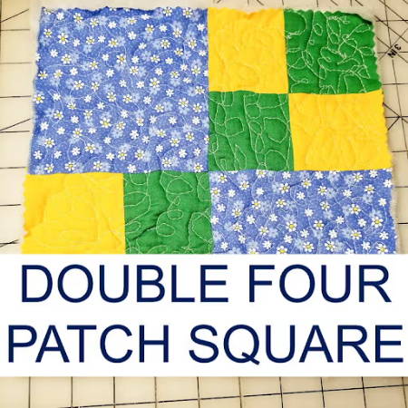 double four patch square quilt block with yellow, green and blue fabric