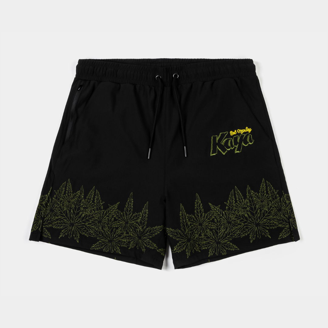 Black swim shorts with green leaf design and 
