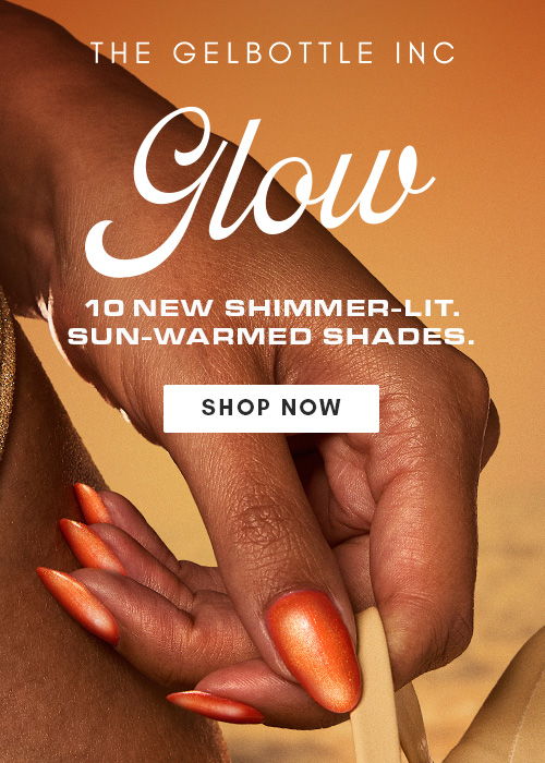 Hand with orange nails, promoting new shimmer-lit nail polish shades.