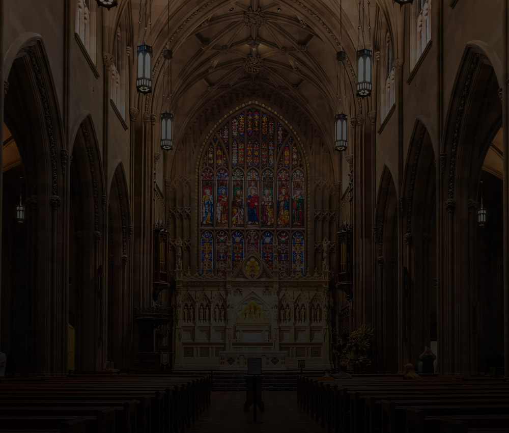Church interior with stained glass windows and vaulted ceilings, representing security and monitoring solutions for faith-based organizations