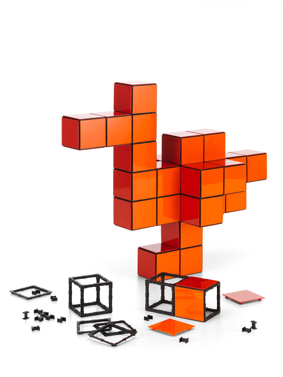 Colorful abstract structure resembling a bird made from PANTON cube blocks.