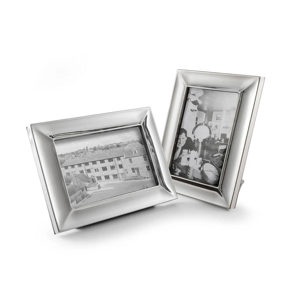Two Vale photo frames with black-and-white photos inside.