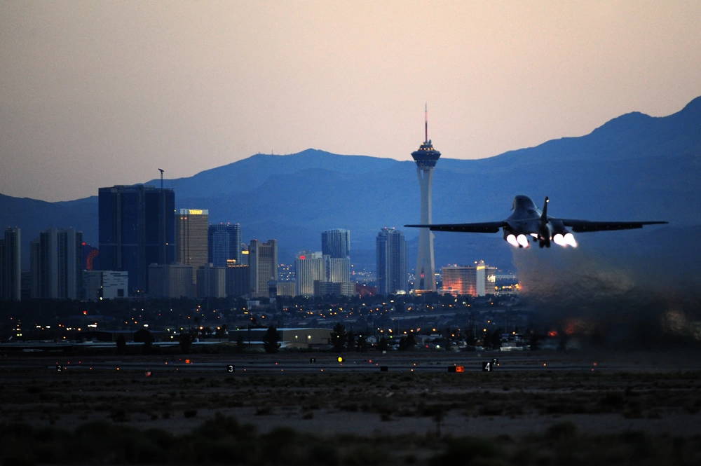 A B-1B Lancer from the 28th Bomb Wing, Ellsworth Air Force Base, S.D., ascends toward the Las Vegas Strip, May 15, 2012, at Nellis Air Force Base, Nev. The B-1B Lancer was developed by Rockwell International, now Boeing Defense And Space Group, and is one of the U.S. Air Force's long-range bombers. During the Green Flag-West exercise, the bombers rehearsed their air support role with ground units preparing for deployment at the National Training Center at Fort Irwin, Calif.