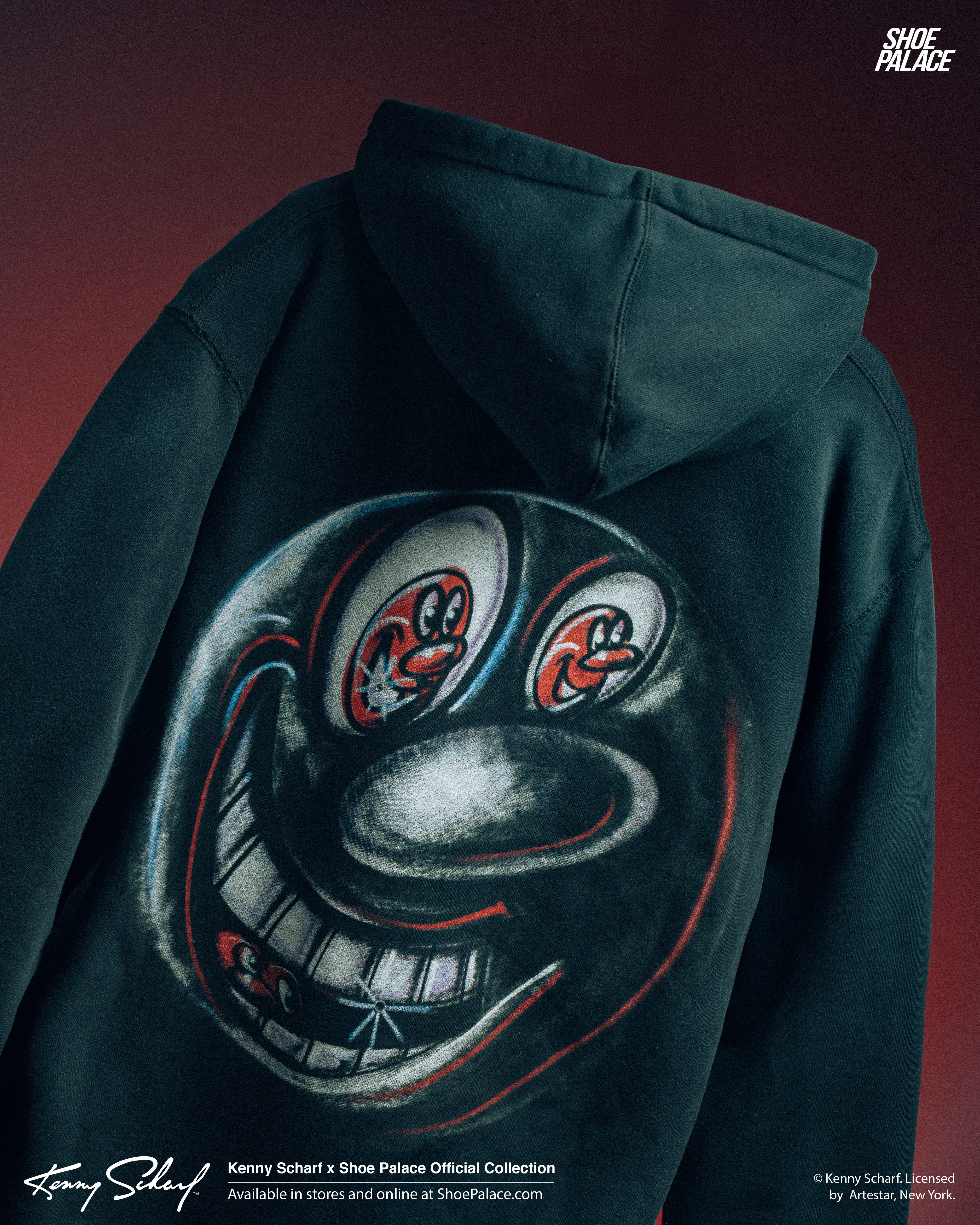 A black hoodie with a large, stylized smiling face design on the back.
