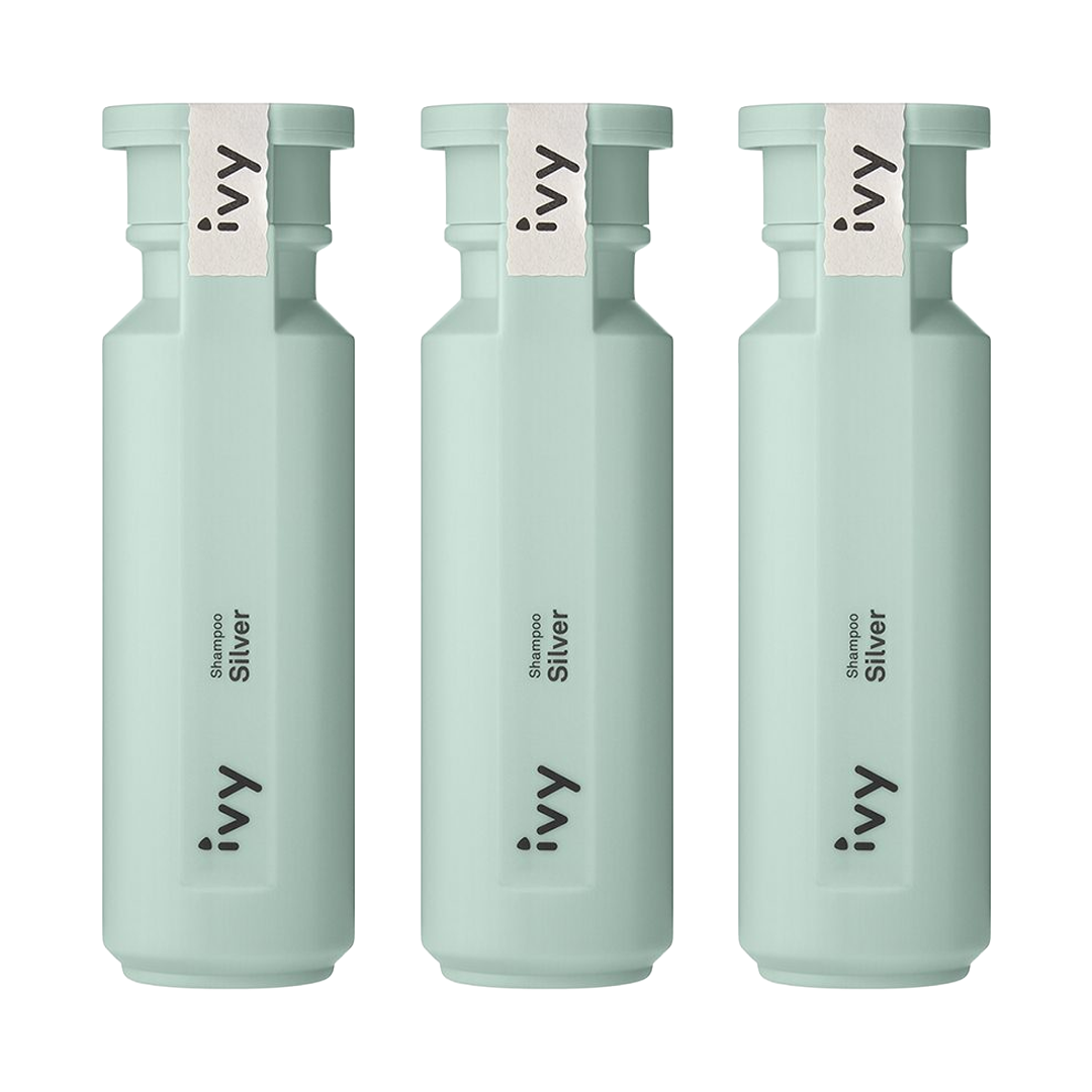 Three mint-colored bottles with white labels.