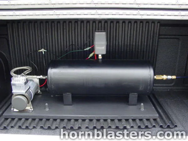 Close-up of the air tank and compressor mounted in the bed of Kevin's 2002 Chevrolet S10, install photo 3